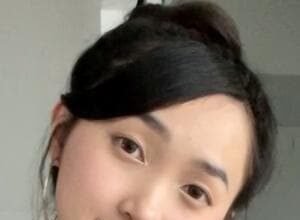 Clara Dao smiling in front of the camera